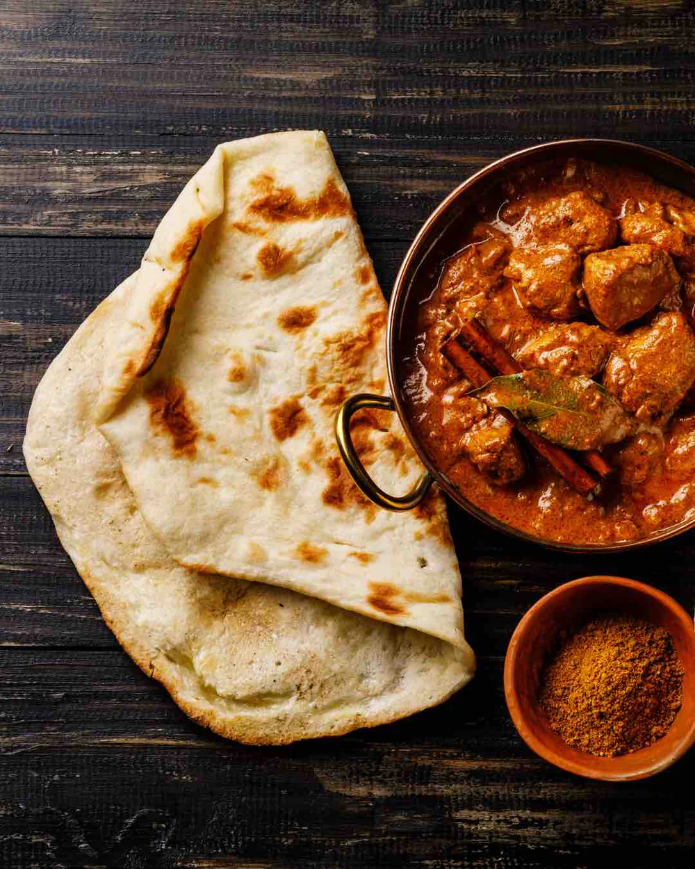 Mughlai curry and bread served at a restaurant